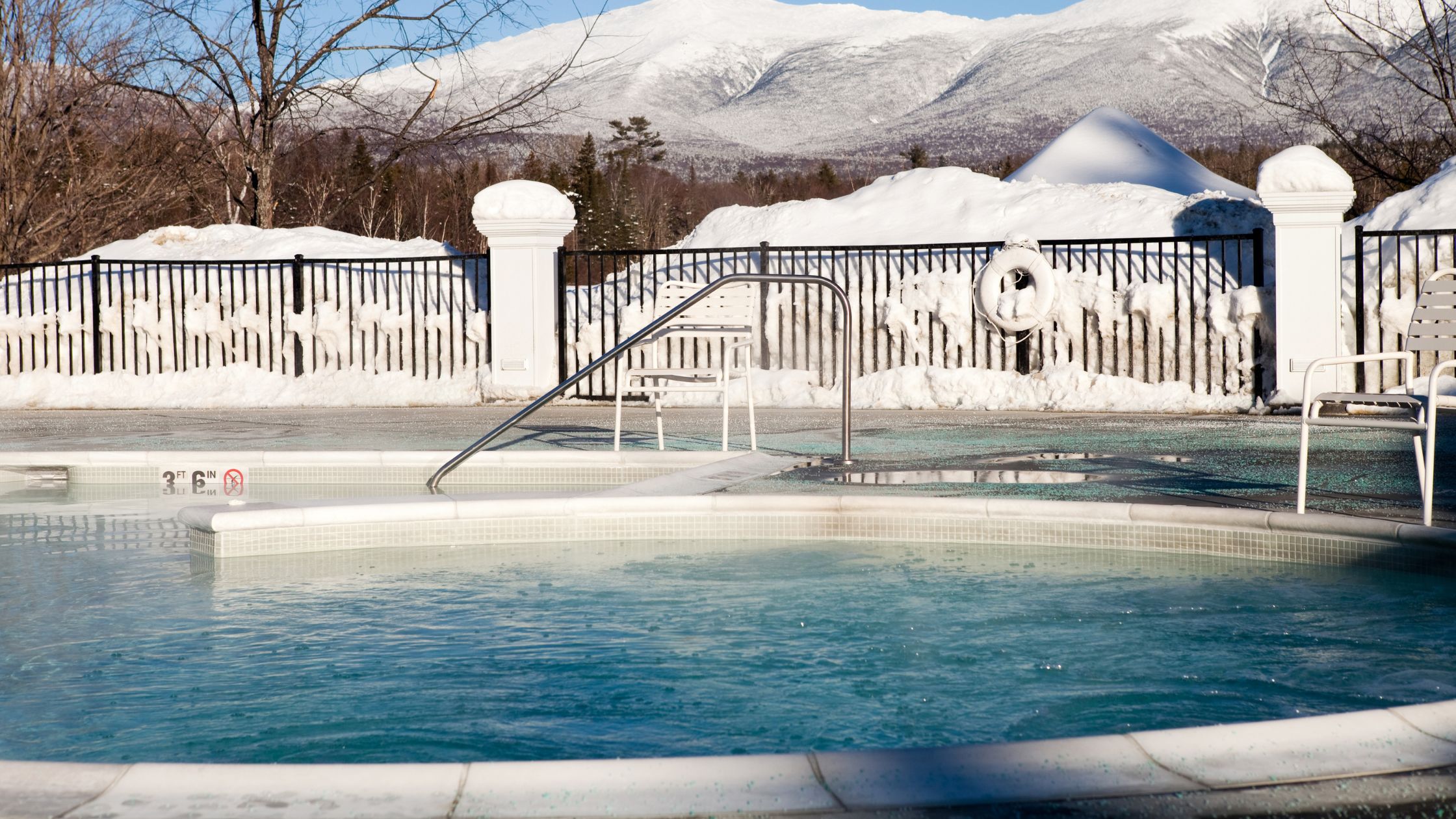 An open pool in a snowy environment - Winterize with API Water